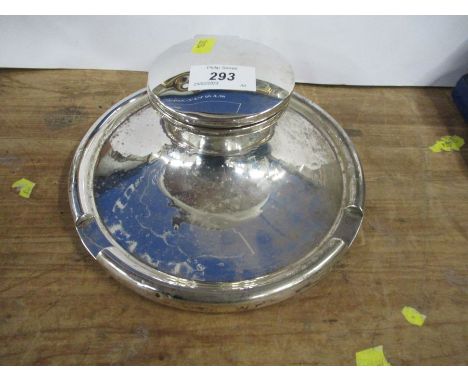 A silver inkwell, of circular form, marks rubbed