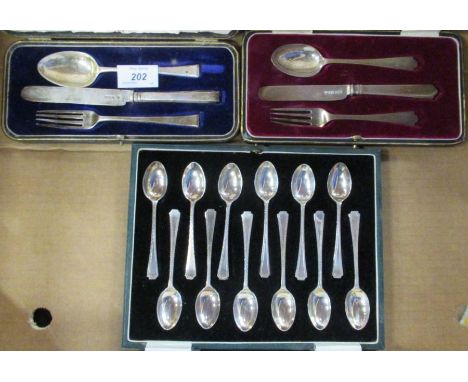 Two cased silver christening sets, knife, fork and spoon, together with a cased set of twelve silver bright cut tea spoons