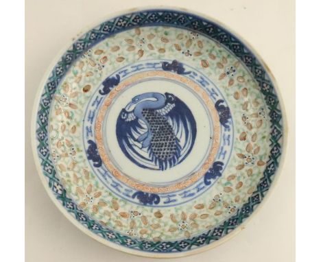 An 18th century Chinese plate, the central panel decorated with a bird to a stylised foliate border, six character marks to t
