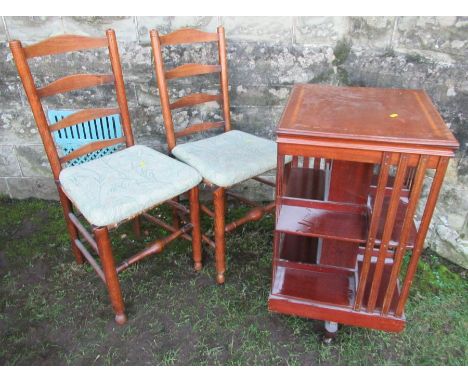 An Edwardian Square revolving book stand, width 19ins, height 33ins, together with 2 ladder back chairs and an Edwardian corn