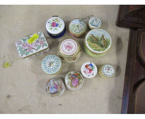 Eight enamel patch boxes, to include Halcyon Days and three porcelain patch boxes