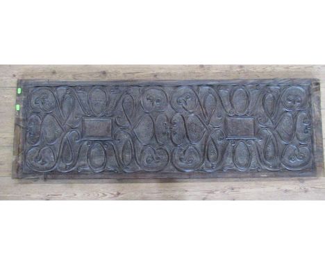 A Continental carved wooden rectangular panel, with scroll decoration, 56ins x 18ins