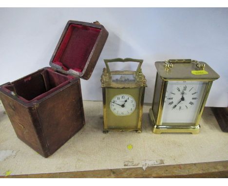 A brass carriage clock, Butt and Co Worcester, in a leather covered case, together with a modern brass carriage clock