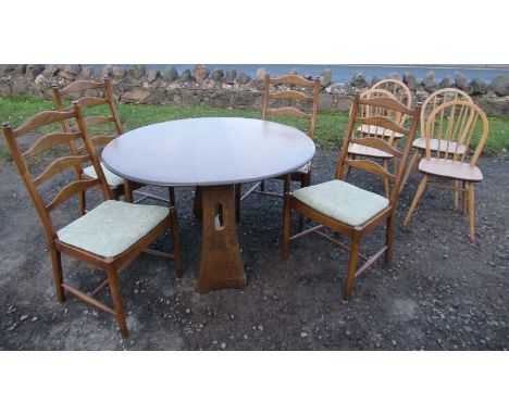 An Ercol gate leg table, together with 4 ladder backed Ercol chairs and 4 kitchen chairs&nbsp;