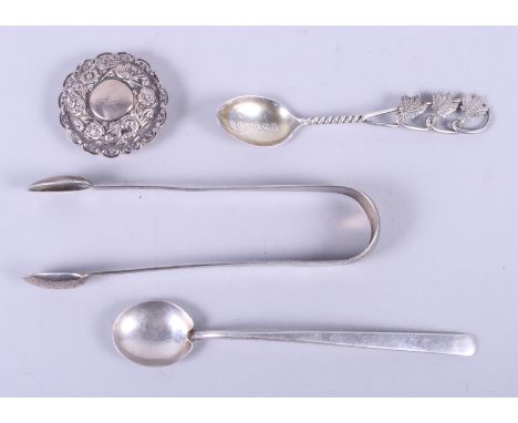 A George V silver engine turned cigarette box, a pair of Georgian bright cut sugar tongs, a silver preserve spoon and two oth