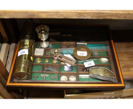An early 20th century Turkish brass coffee grinder with key, a silver chalice and pattern, and a cased diorama of collectable