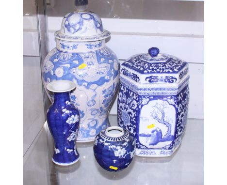 A Chinese blue and white prunus decorated baluster vase, a similar ginger jar, a hexagonal jar and cover, decorated foliate p