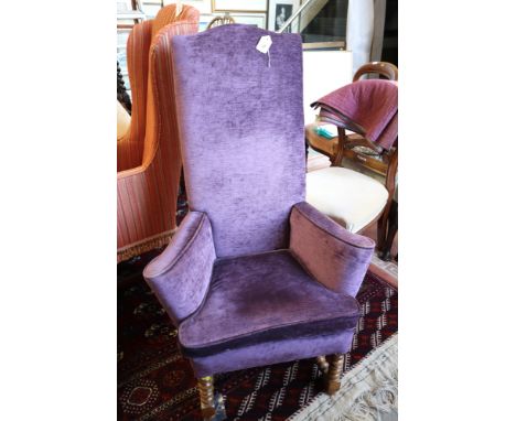 A high back armchair of early 18th century design, on bobbin turned and stretchered supports 