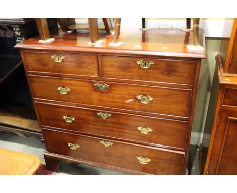 A George III mahogany chest of two short and three long graduated drawers, on bracket feet, 40 1/2" wide 