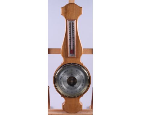 A mid 20th century oak aneroid barometer, complete with instructions, 21" long 