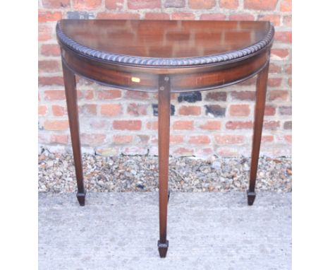 A walnut shape top occasional table, 21" wide, and a walnut semicircular fold-over top card table, on square taper supports, 