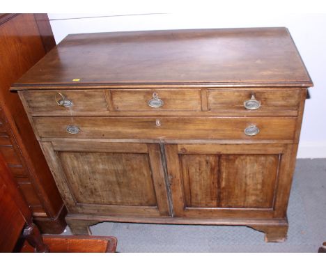 A 19th century mahogany side cabinet, fitted four drawers over cupboards, on bracket feet, 42" wide