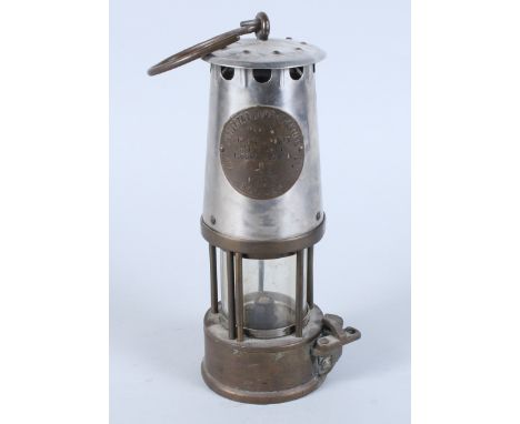 A Protector Lamp & Lighting Co Ltd of Eccles, Manchester miner's lamp, 9" high 