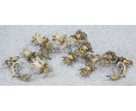 A PAIR OF ROCOCO STYLE ORMOLU FIVE LIGHT WALL SCONCES cast with acanthus scrolls, with wall brackets. (2) 33cm high, 37cm dee