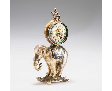 A RARE MINIATURE VIENNESE SILVER-GILT AND ENAMEL ELEPHANT CLOCK, 19TH CENTURY the elephant modelled with an enamel decorated 