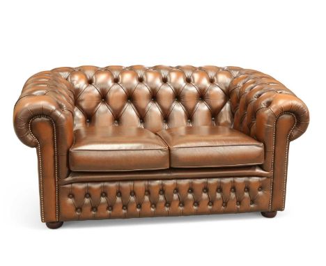 A BROWN LEATHER CHESTERFIELD TWO-SEATER SOFA with deep-buttoned back, sides and front. 148cm wideIn excellent condition witho