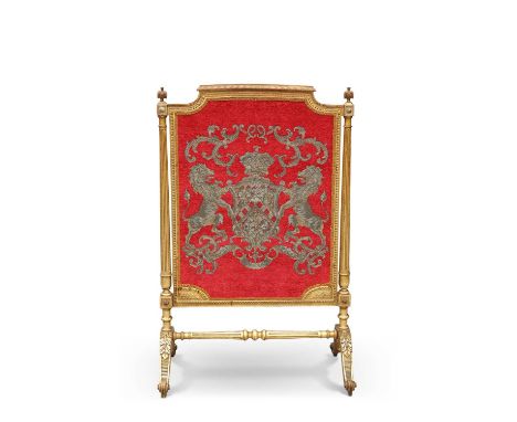 A LOUIS XVI STYLE GILTWOOD FIRESCREEN, 19TH CENTURY with fluted tapering columns, raised on leaf-capped bipartite legs termin