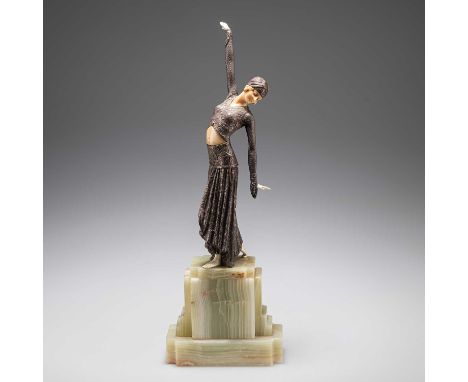 AN ART DECO BRONZE AND FAUX IVORY FIGURE on a stepped onyx base, (a/f). 39.5cm highHead detached with glue residue, one hand 