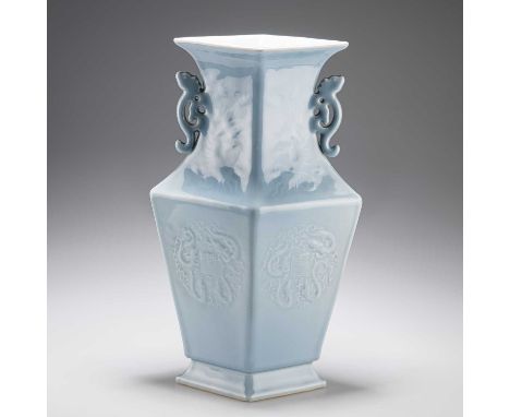 A CHINESE BLUE-GLAZED LOZENGE-SHAPED VASE the moulded body with twin handles, bears an underglaze blue seal-type mark. 35cm h