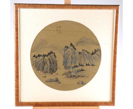 CHINESE SCHOOL (20TH CENTURY), A MOUNTAINOUS LANDSCAPE WITH BOATS circular, ink and watercolour, laid on silk, signed with a 