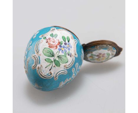 A BILSTON BLUE ENAMEL EGG-SHAPED BONBONNIÈRE, CIRCA 1770 with a hinged cover, decorated with two C-scroll framed cartouches c