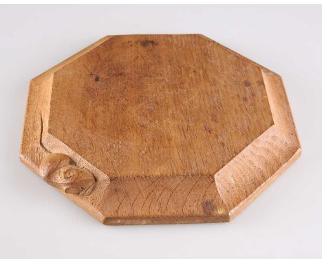 ROBERT THOMPSON OF KILBURN, A MOUSEMAN OAK TEAPOT STAND/SMALL CHOPPING BOARD octagonal, adzed edge, with carved mouse signatu