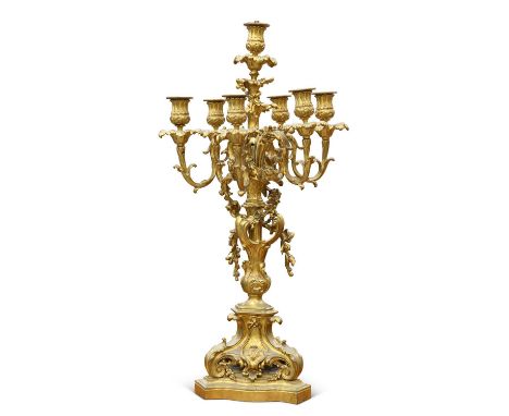 A FRENCH ORMOLU SEVEN-LIGHT CANDELABRA, 19TH CENTURY with scrolling foliate decoration and applied trailing floral decoration