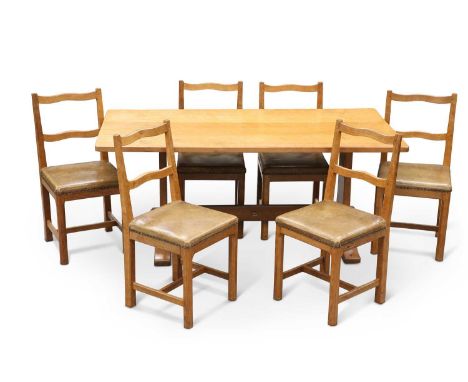 DEREK SLATER, A FISHMAN OAK DINING TABLE AND SIX CHAIRS the adzed refectory table with trestle ends, the chairs with wavy lad