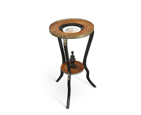 A LATE 19TH CENTURY GILT METAL-MOUNTED, EBONISED AND INLAID GUÉRIDON the circular top inset with a porcelain dished plaque de