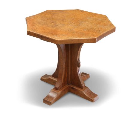 ROBERT THOMPSON OF KILBURN, A MOUSEMAN OAK COFFEE TABLE the adzed octagonal top raised on a cruciform base, with carved mouse