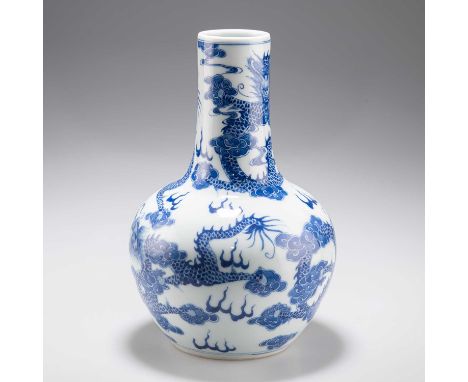 A CHINESE BLUE AND WHITE 'DRAGON' VASE the bulbous body issuing a cylindrical neck, blue painted with dragons, bears an under