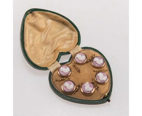 A SET OF SIX PASTE CAMEO BUTTONS in pink and white paste, each with a bust portrait, in metal mounts, in a fitted heart-shape