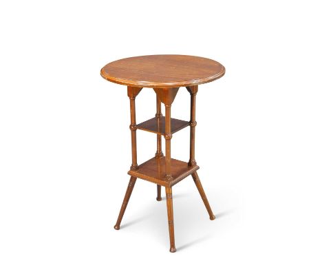 AN ARTS AND CRAFTS WALNUT OCCASIONAL TABLE with circular top and shelf stretcher. 69.5cm high, 47.5cm diameterStructurally so