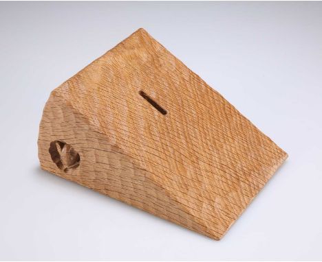 ROBERT THOMPSON OF KILBURN, A MOUSEMAN OAK MONEY BOX wedge-shaped, adzed all over, with recessed carved mouse signature. 9cm 