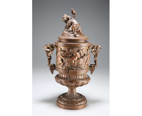A LATE 19TH CENTURY FRENCH BRONZE URN, IN THE MANNER OF CLODION decorated with Bacchanalian putti, with a cover and a lift-ou
