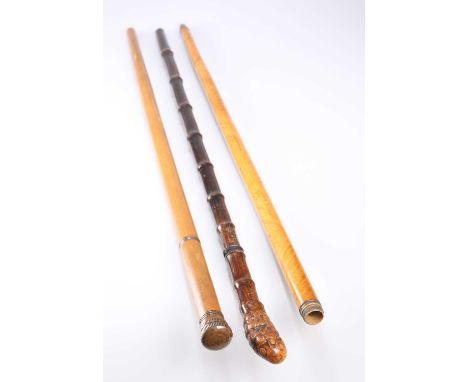 A 19TH CENTURY BAMBOO SWORD STICK with root handle and tapering steel blade signed SOLINGEN; together with a cane with a scre