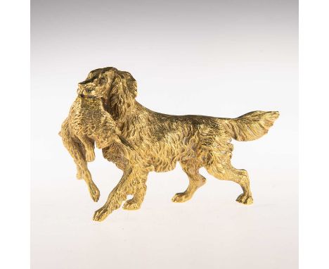 AN AUSTRIAN BRONZE MODEL OF A COCKER SPANIEL, EARLY 20TH CENTURY cast holding a rabbit in its mouth, stamped GESCHUTZT. 12.3c
