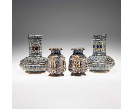 TWO PAIRS OF LATE 19TH CENTURY DOULTON LAMBETH STONEWARE VASES the first pair of squat form with long cylindrical necks, impr