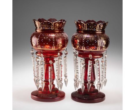 A NEAR PAIR OF 19TH CENTURY RUBY GLASS LUSTRES  with gilt and enamel fruiting vine and scroll decoration, complete with clear