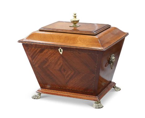 A 19TH CENTURY MAHOGANY CELLARETTE of sarcophagus form, with lion mask ring handles and cast brass paw feet, Bramah lock. 49c