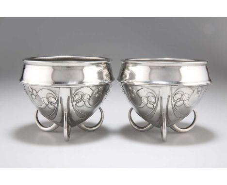 ARCHIBALD KNOX (1864-1933) FOR LIBERTY &amp; CO, A PAIR OF TUDRIC PEWTER BOWLS nos. 0277, circular, cast with stylised foliag