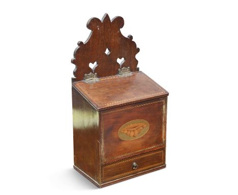 A GEORGE III INLAID MAHOGANY CANDLE BOX with a hinged cover above a front centred by an inlaid oval containing a conch shell,