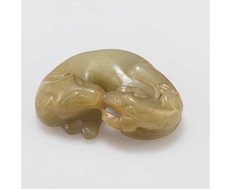 A CHINESE JADE 'BADGERS' GROUP carved in openwork with a feline-like badger lying down with her cub. 5.5cm wideIn good condit