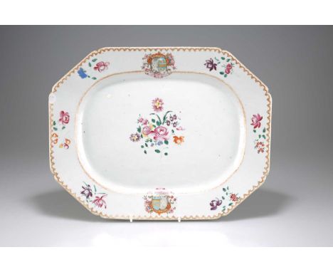 A CHINESE ARMORIAL PORCELAIN PLATTER, QIANLONG, CIRCA 1755 painted in Famille Rose enamels, the centre painted with a floral 