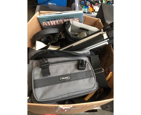 A box of camera equipment, bags, binoculars, tripod, etc 