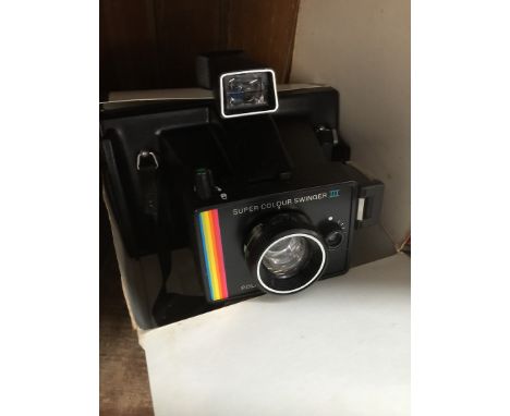 A Polaroid Super Colour Swinger III land camera 