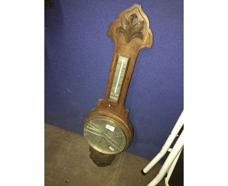 A wooden barometer ( glass broken ) 