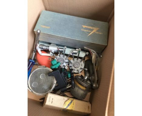 A box of assorted watchmakers tools 