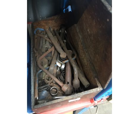 A wooden case with old tools 
