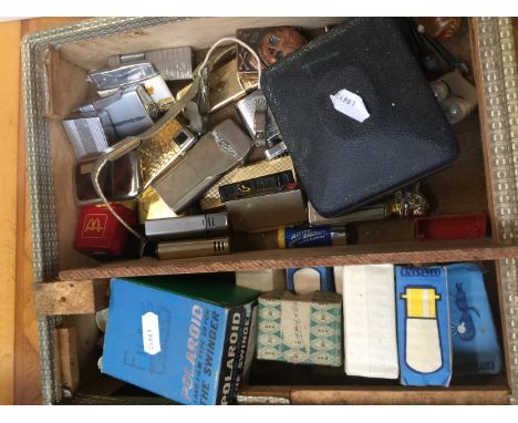 Box of vintage lighters and small bulbs etc. 